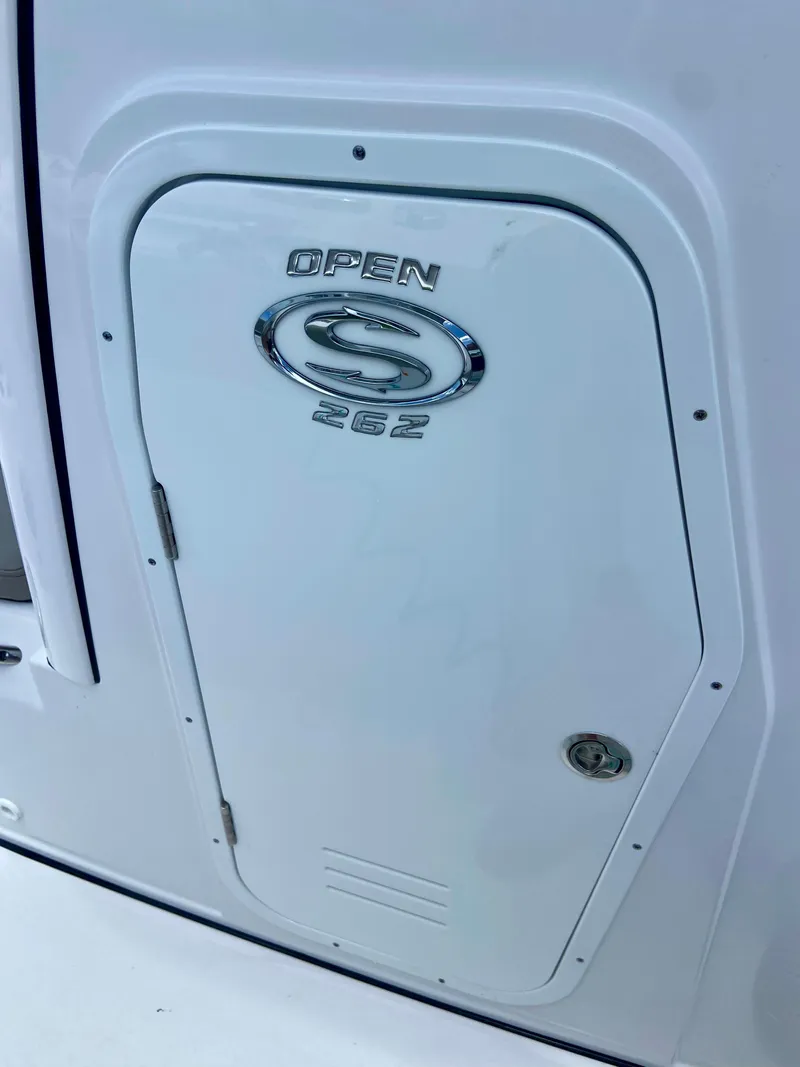 Slide: The Image of 2025 Sportsman Open 262 Center Console boat compartment door. - 6