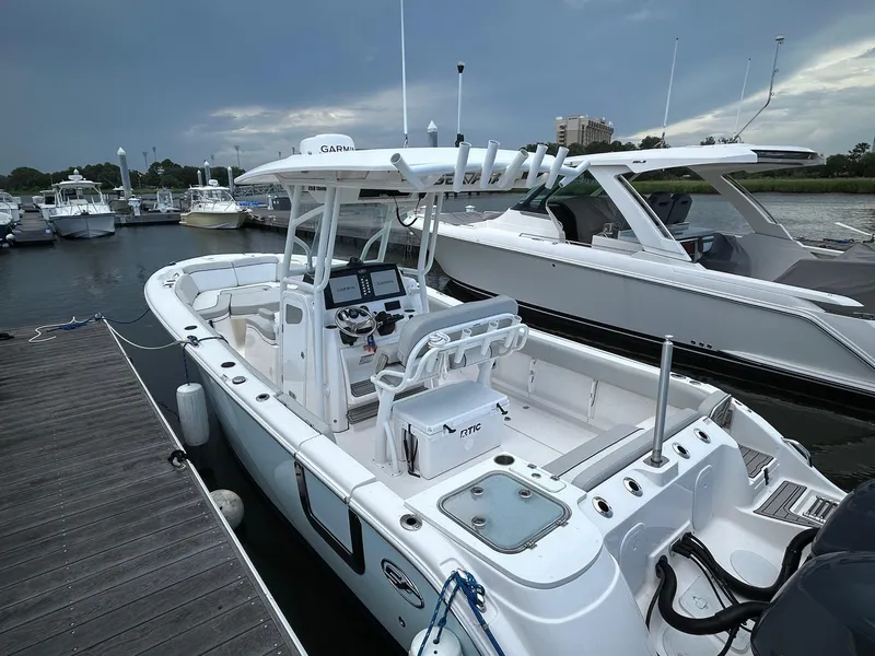 Slide: The Image of 2022 Sea Fox 268 Commander boat docked at marina, featuring sleek design and modern equipment. - 15