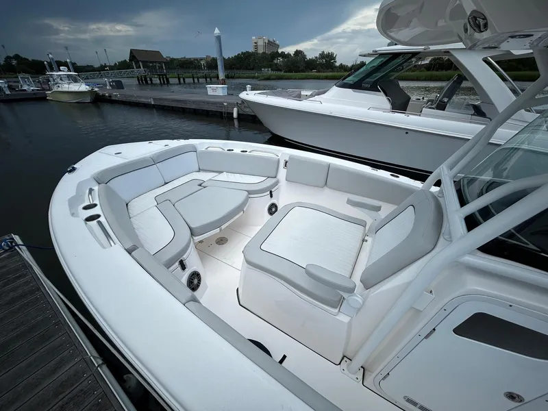 Slide: The Image of 2022 Sea Fox 268 Commander boat with spacious seating at a marina. - 8
