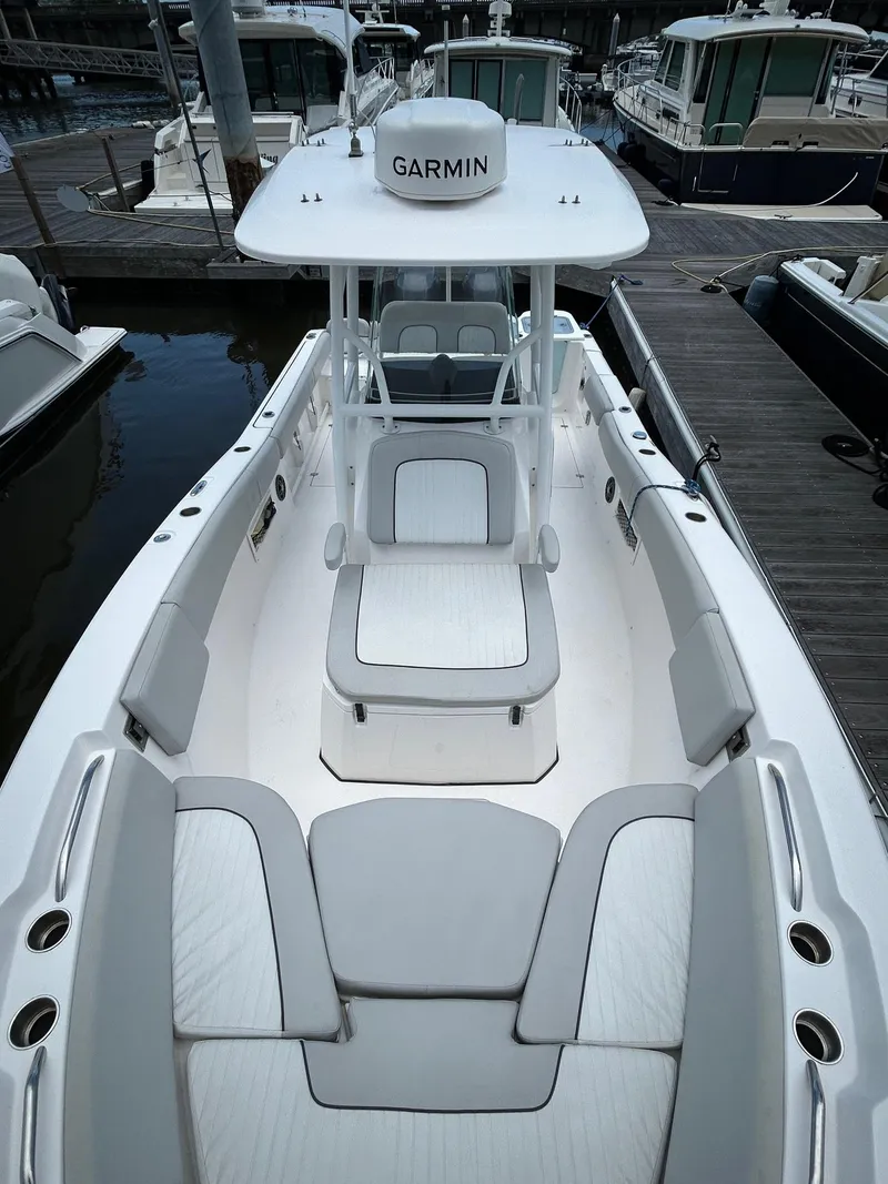 Slide: The Image of 2022 Sea Fox 268 Commander boat with Garmin equipment, docked at a marina. - 9