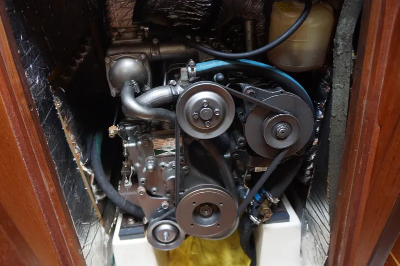 Slide: The Image of Engine of a 1993 Hunter 35.5 sailboat, showcasing belts and components. - 15