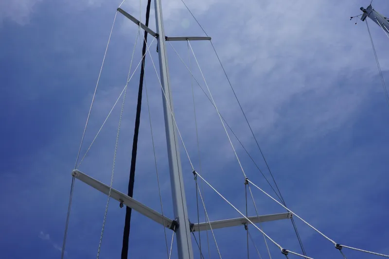 Slide: The Image of Mast and rigging of a 1993 Hunter 35.5 sailboat against a clear blue sky. - 20