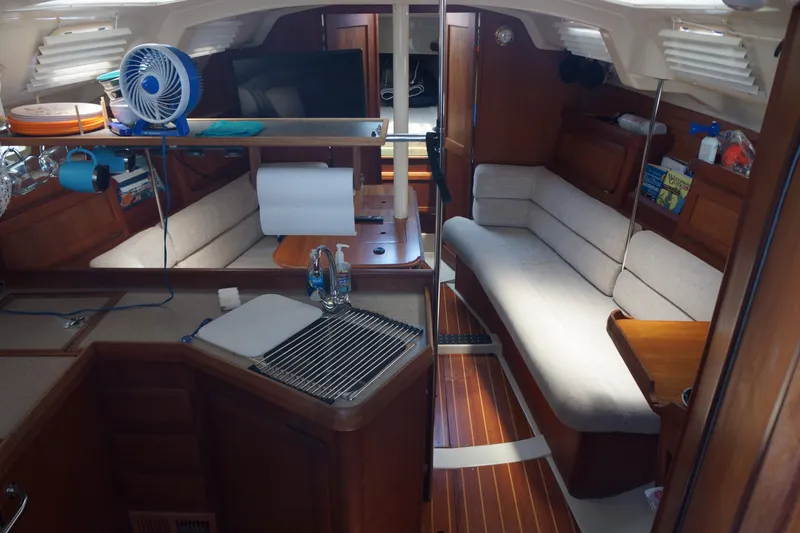 Slide: The Image of Interior of a 1993 Hunter 35.5 sailboat with cozy seating and wooden finishes. - 22