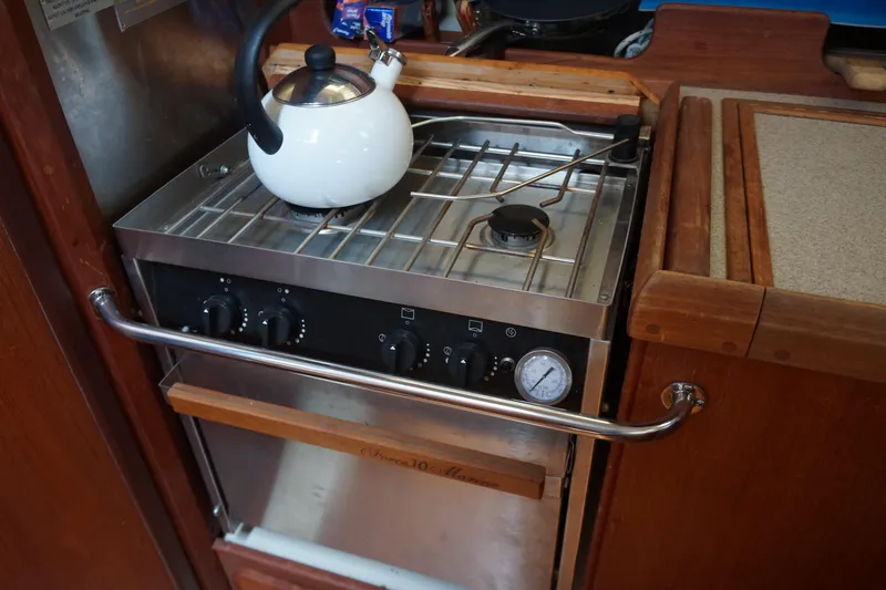 Slide: The Image of Compact kitchen stove with kettle in 1993 Hunter 35.5 model boat. - 27