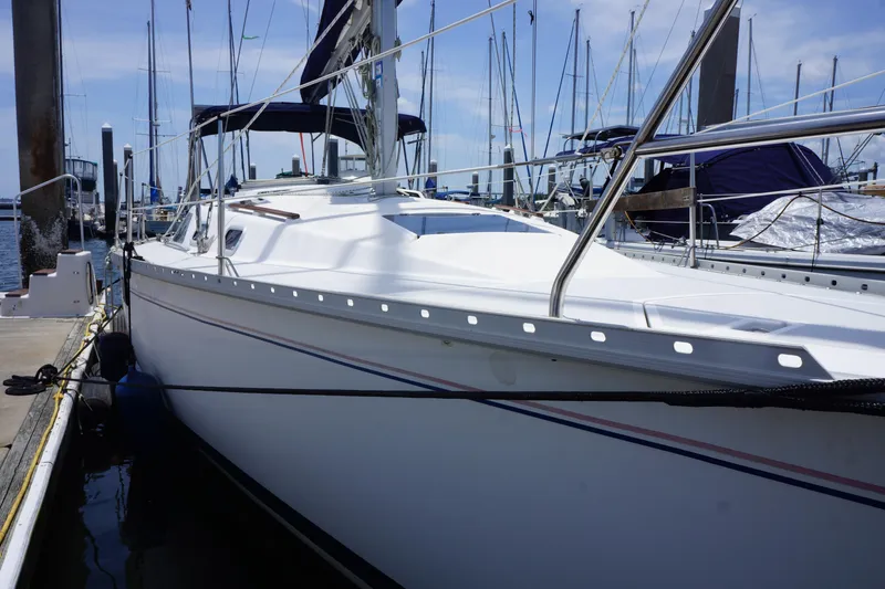 Slide: The Image of Sailboat docked at marina, 1993 Hunter 35.5 model, clear sky background. - 5