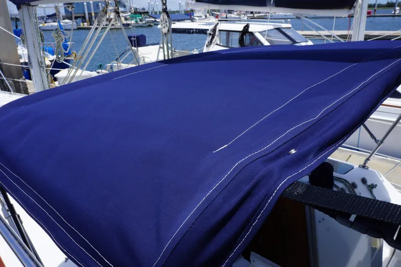 Slide: The Image of Blue canvas cover on 1993 Hunter 35.5 sailboat, docked at marina. - 9