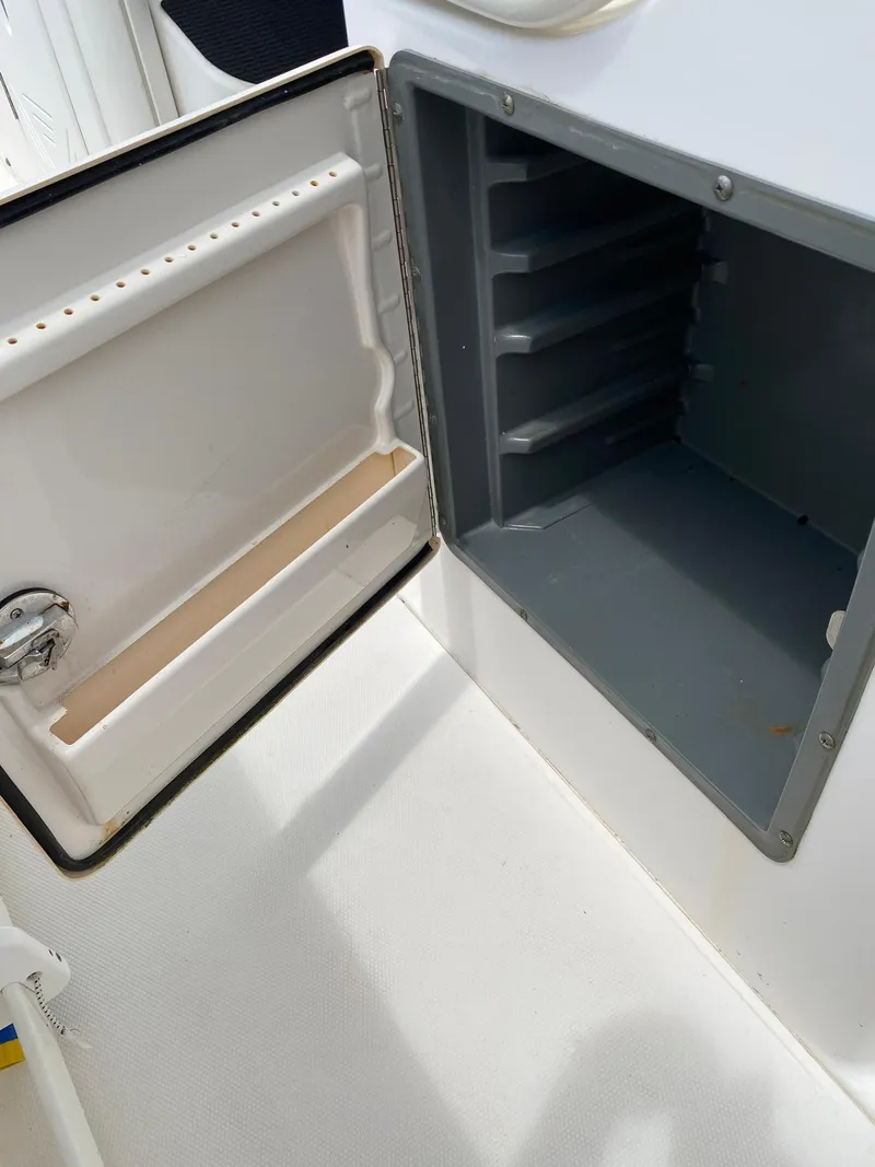 Slide: The Image of Open storage compartment on a 2006 Everglades 260 CC boat. - 10