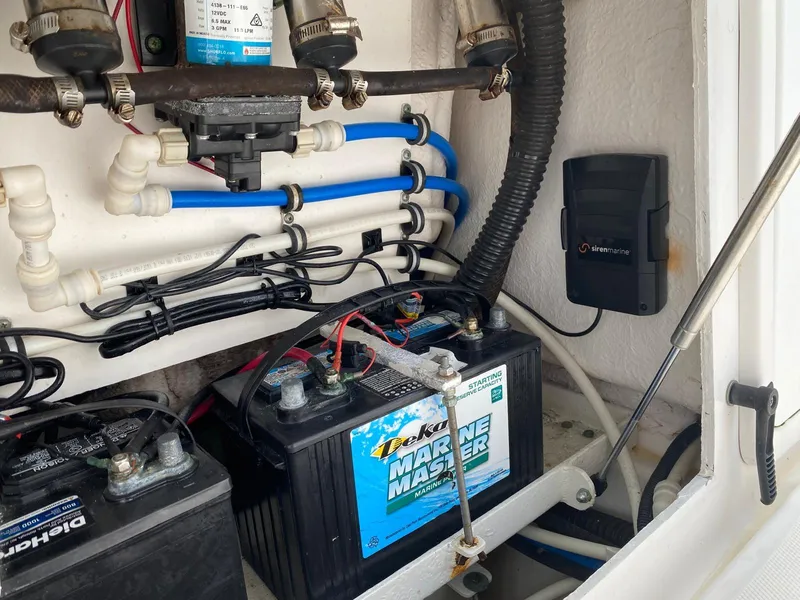 Slide: The Image of Electrical system of a 2006 Everglades 260 CC boat with marine batteries and wiring. - 11