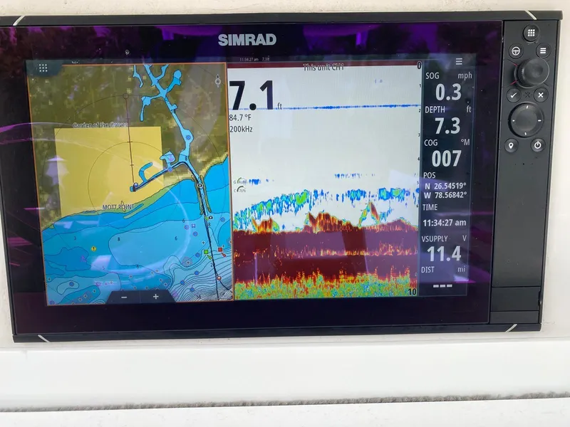 Slide: The Image of Simrad marine GPS display on 2006 Everglades 260 CC showing navigation and sonar data. - 5