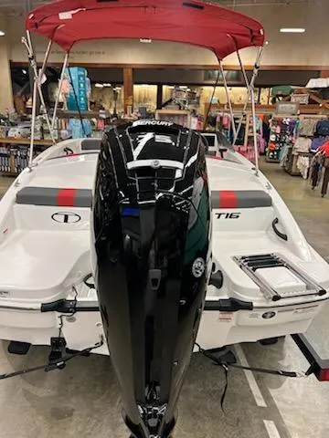 Slide: The Image of 2025 Tahoe T16 boat with red canopy and powerful Mercury outboard motor. - 5