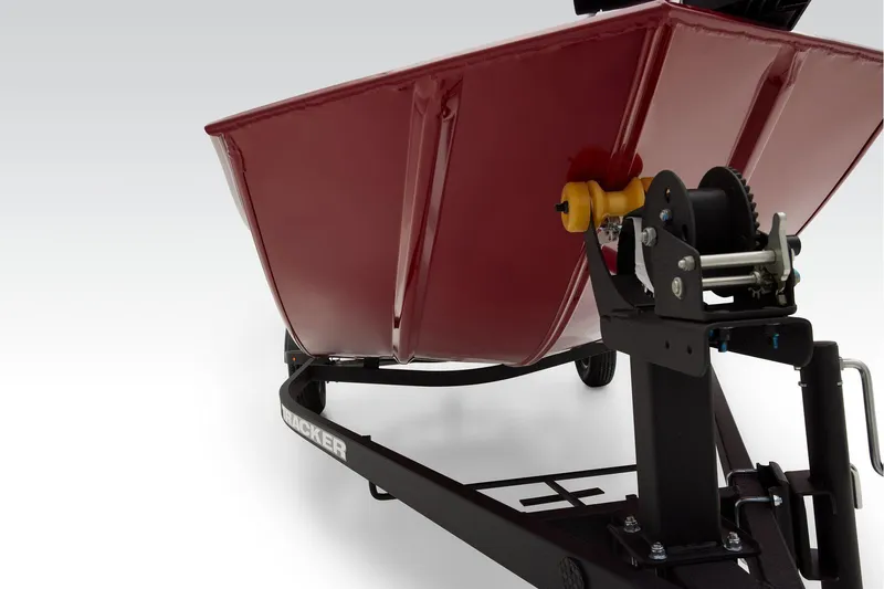 Slide: The Image of 2025 Tracker Panfish 17 boat control panel with switches and throttle lever. - 9