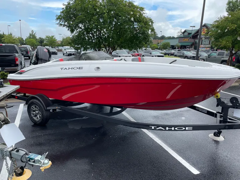 The Image of 2025 Tahoe T18 boat in parking lot, red and white design, on trailer. - 0