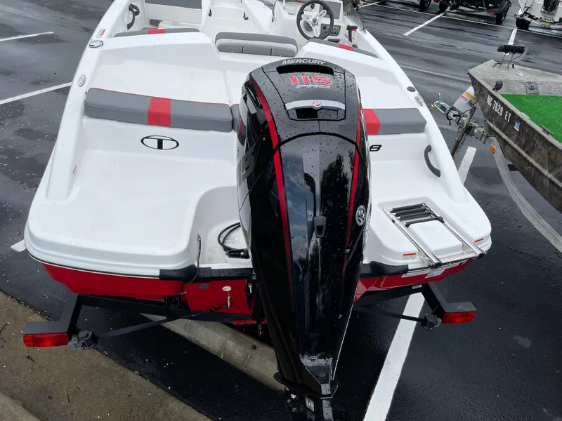 Slide: The Image of 2025 Tahoe T18 boat with Mercury engine, parked on wet pavement. - 3