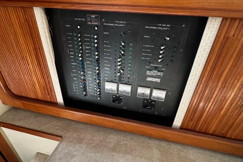 Slide: The Image of Electrical panel of a 1988 Carver 38 Aft Cabin boat, featuring various switches and controls. - 27