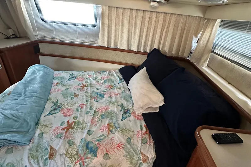 Slide: The Image of Cozy bedroom in 1988 Carver 38 Aft Cabin with floral bedding and natural light. - 29