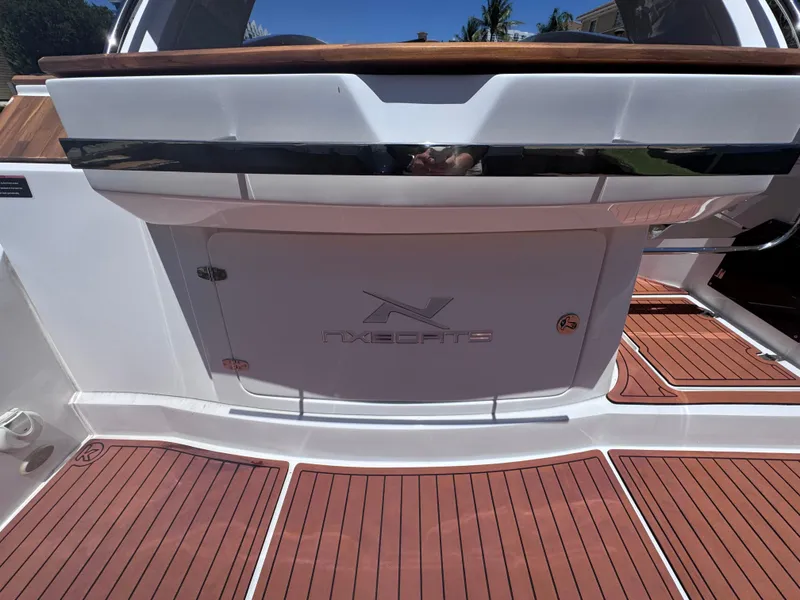 Slide: The Image of 2024 NX Boats 340 Sport Coupe with sleek deck design and modern features. - 15