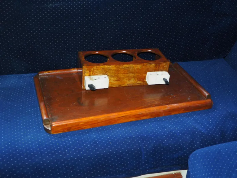 Slide: The Image of Wooden cup holder on blue fabric, Endeavour 33, 1984 model. - 17