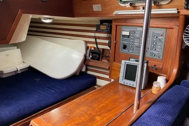 Slide: The Image of 1984 Endeavour 33 yacht interior with navigation equipment and wooden furnishings. - 31