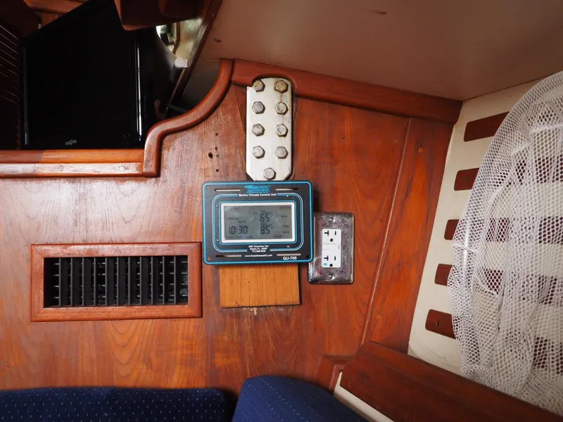 Slide: The Image of Wooden interior of 1984 Endeavour 33 sailboat with digital display and vent. - 32