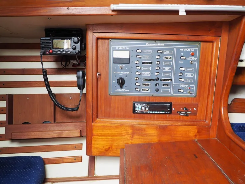 Slide: The Image of Electrical panel and radio equipment inside a 1984 Endeavour 33 sailboat cabin. - 33