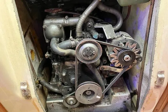 Slide: The Image of 1984 Endeavour 33 engine compartment with visible belts and components. - 36