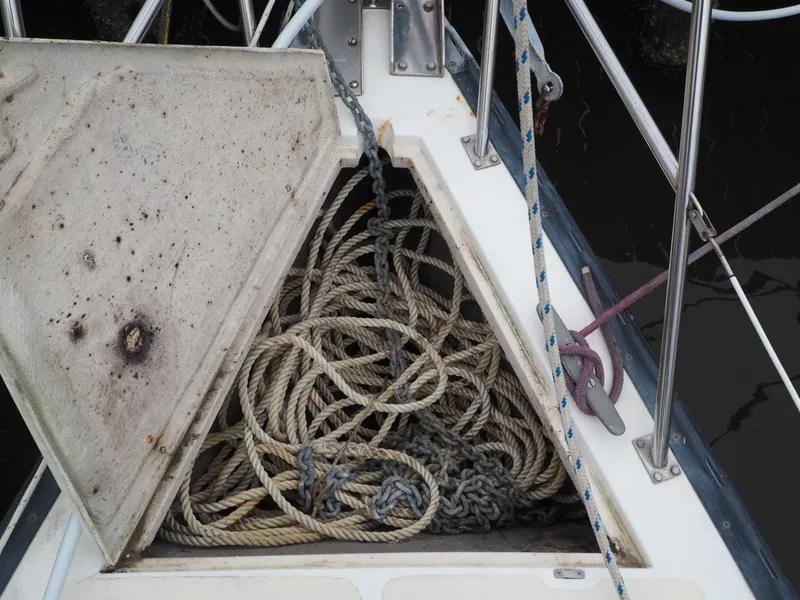 Slide: The Image of Anchor locker of 1984 Endeavour 33 sailboat with coiled ropes and chain. - 9