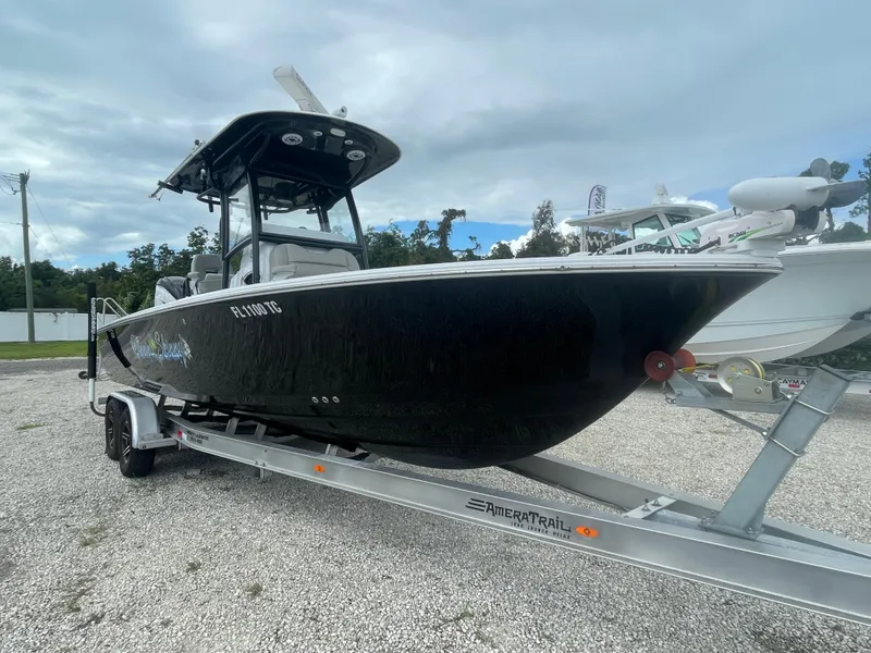 The Image of 2022 Sportsman Masters 267OE Bay Boat on trailer, parked outdoors. - 0