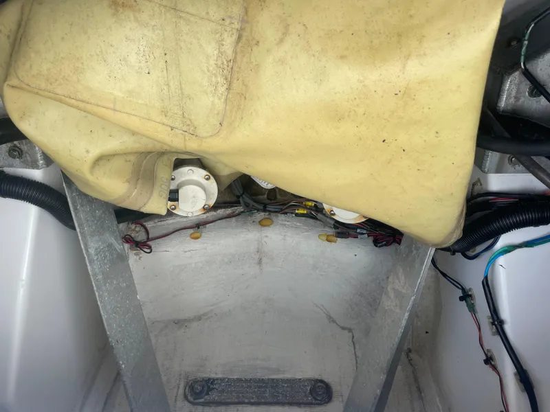 Slide: The Image of Interior view of a 2022 Sportsman Masters 267OE Bay Boat showing wiring and components. - 15