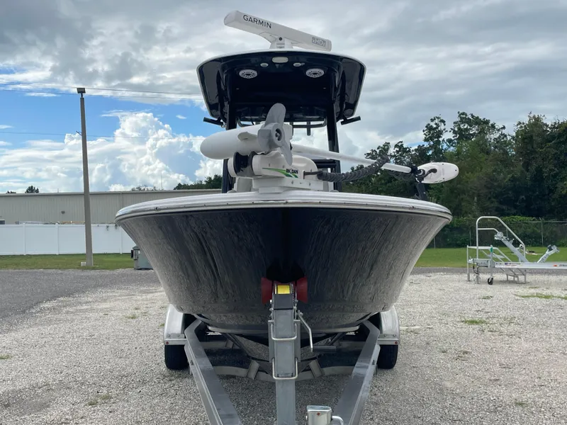 Slide: The Image of 2022 Sportsman Masters 267OE Bay Boat on trailer, front view, cloudy sky background. - 6