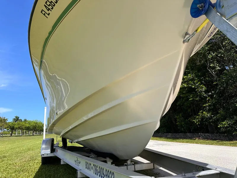 Slide: The Image of 2011 Grady-White Freedom 275 boat on trailer, side view, sunny day. - 10