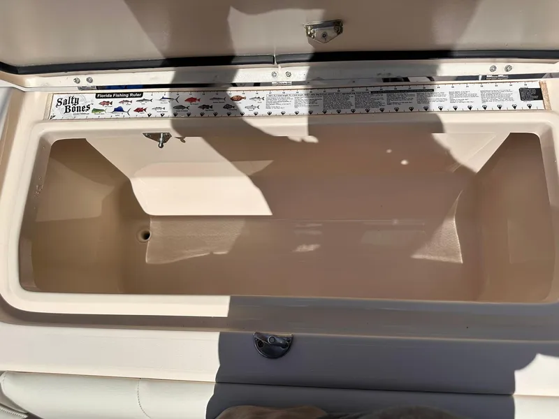 Slide: The Image of Open storage compartment on 2011 Grady-White Freedom 275 boat. - 16