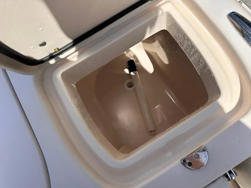 Slide: The Image of Open storage compartment on a 2011 Grady-White Freedom 275 boat. - 17