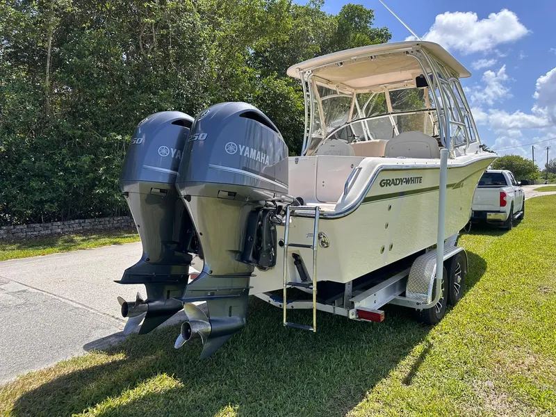 Slide: The Image of 2011 Grady-White Freedom 275 boat with twin Yamaha engines on a trailer. - 3
