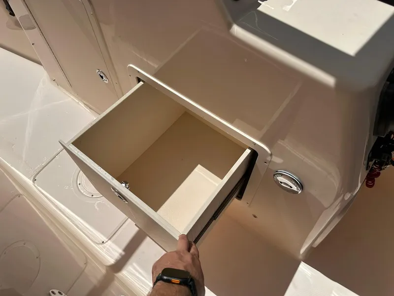 Slide: The Image of Open storage compartment on 2011 Grady-White Freedom 275 boat. - 31