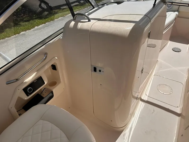 Slide: The Image of Interior view of 2011 Grady-White Freedom 275 boat, featuring seating and storage compartments. - 32