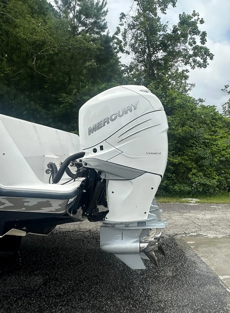 Slide: The Image of 2008 SeaVee 390B boat with Mercury Verado outboard engine, parked outdoors. - 10