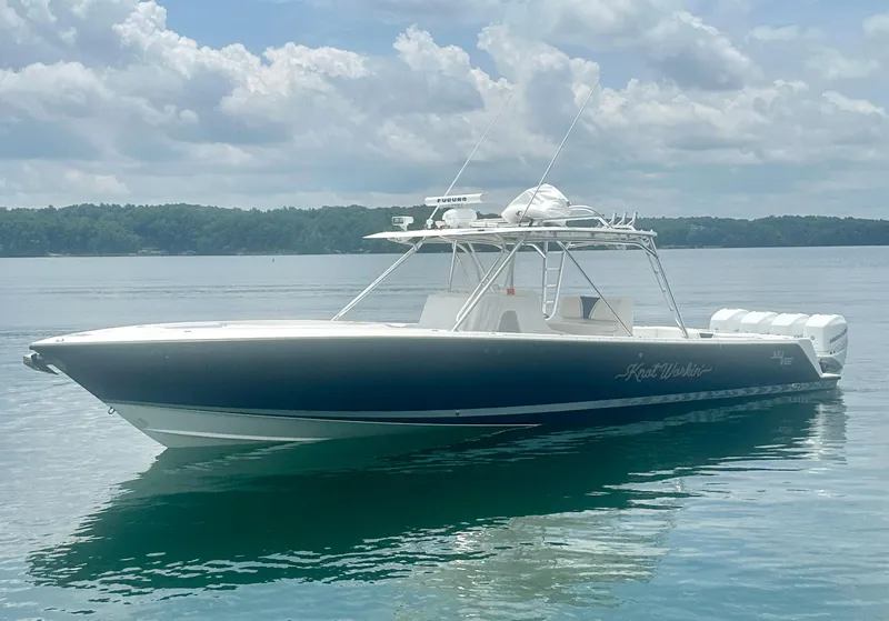 Slide: The Image of 2008 SeaVee 390B boat on calm water under a cloudy sky. - 11