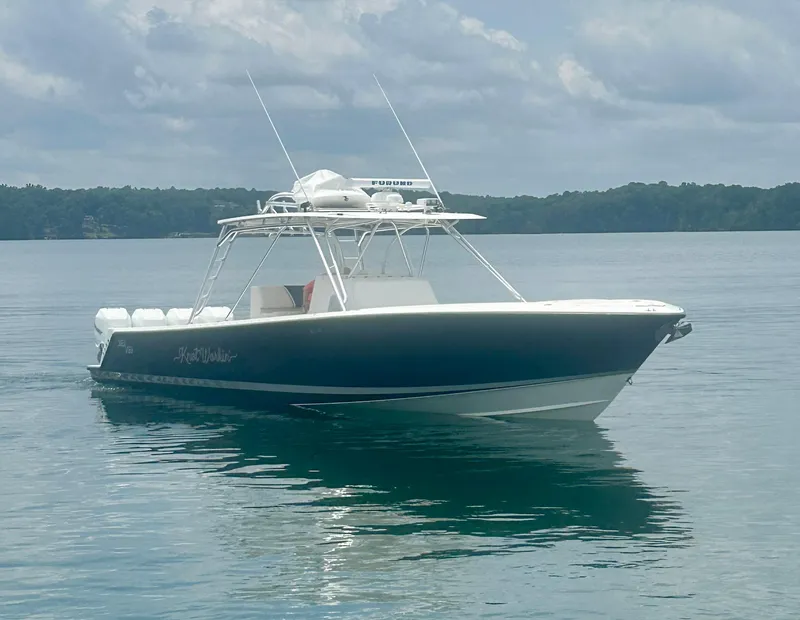 Slide: The Image of 2008 SeaVee 390B boat on calm water under cloudy sky. - 15