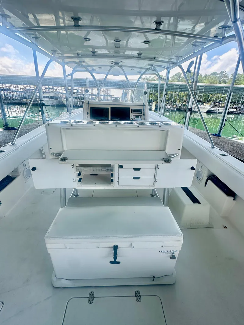 Slide: The Image of 2008 SeaVee 390B boat interior with helm, storage, and seating. - 29