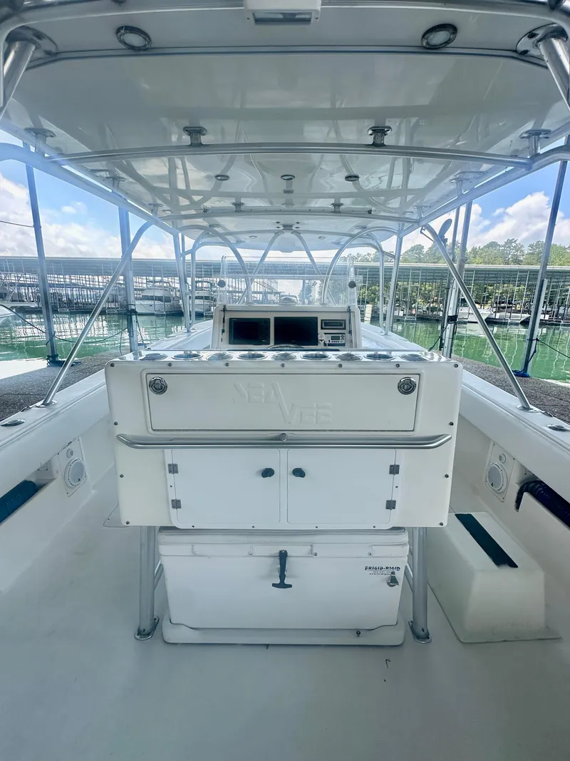 Slide: The Image of 2008 SeaVee 390B boat interior with helm station and storage compartments. - 30