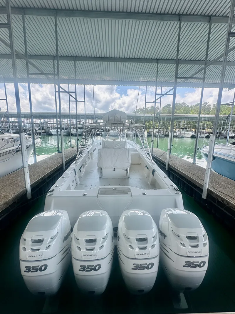 Slide: The Image of 2008 SeaVee 390B boat with four 350 horsepower engines docked in a marina. - 33