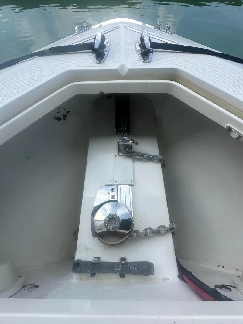 Slide: The Image of 2008 SeaVee 390B boat anchor compartment with chain and winch. - 38