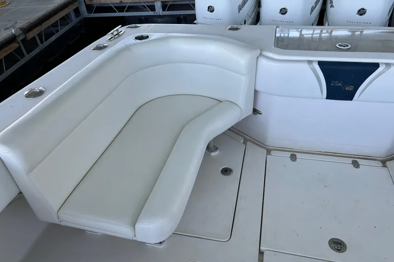 Slide: The Image of White seating area on a 2008 SeaVee 39 boat with multiple outboard engines. - 41