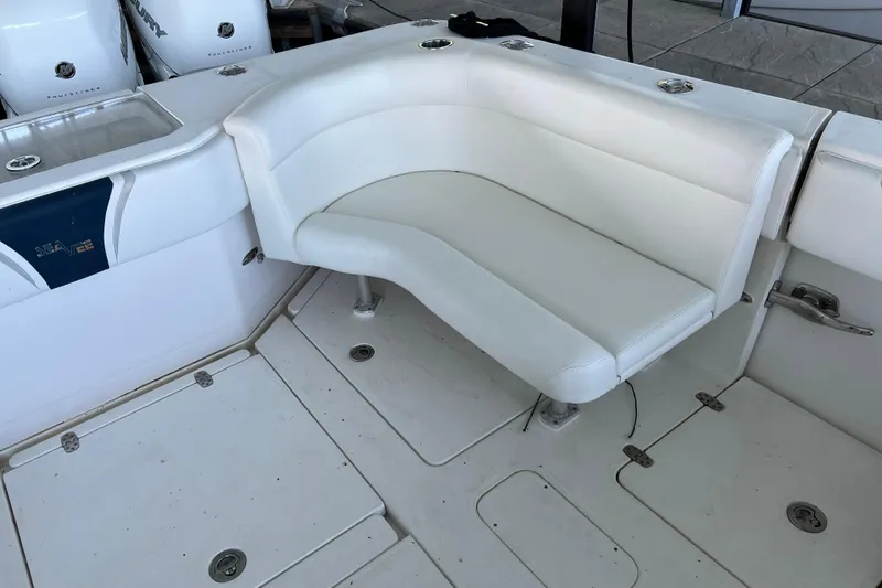 Slide: The Image of 2008 SeaVee 39 boat with white cushioned seating and Mercury outboard engines. - 42