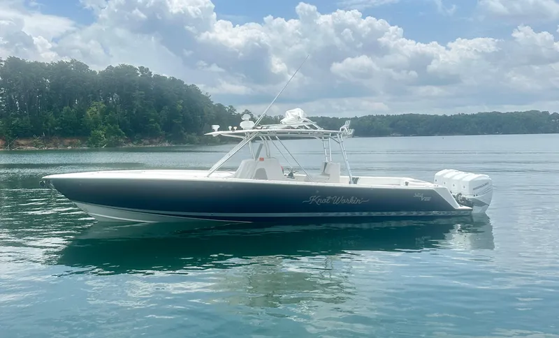 Slide: The Image of 2008 SeaVee 390B boat on calm water under a cloudy sky. - 5