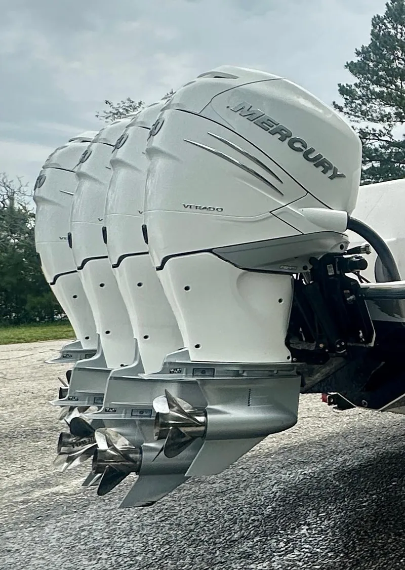 Slide: The Image of 2008 SeaVee 390B with triple Mercury Verado outboard engines, parked outdoors. - 9