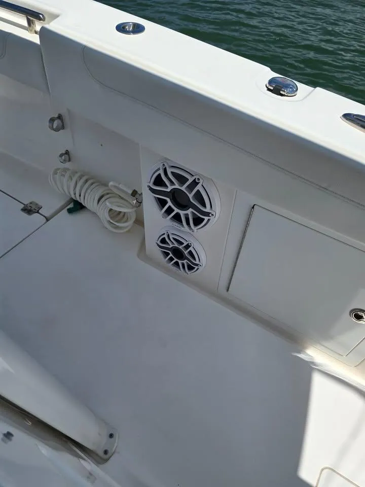 Slide: The Image of 2023 Caymas 30 CT boat interior with speakers and coiled rope. - 12