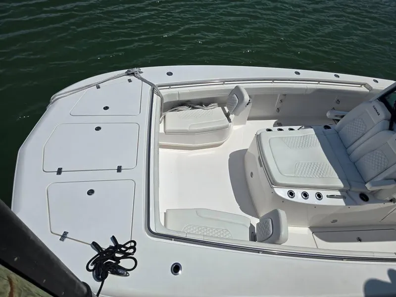 Slide: The Image of 2023 Caymas 30 CT boat deck with seating and storage compartments. - 19