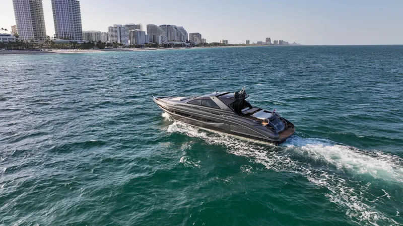 Slide: The Image of Luxury yacht Riva 68' EGO SUPER 2009 cruising near city skyline. - 12