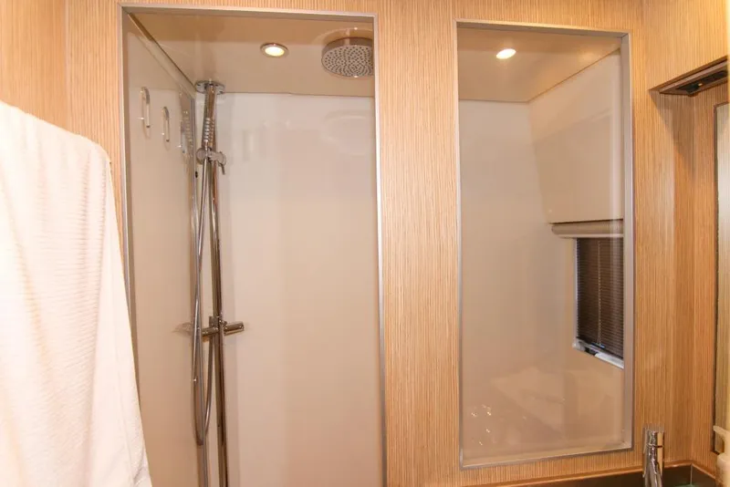 Slide: The Image of Luxurious bathroom shower in 2009 Riva 68' EGO SUPER yacht, featuring modern fixtures. - 15